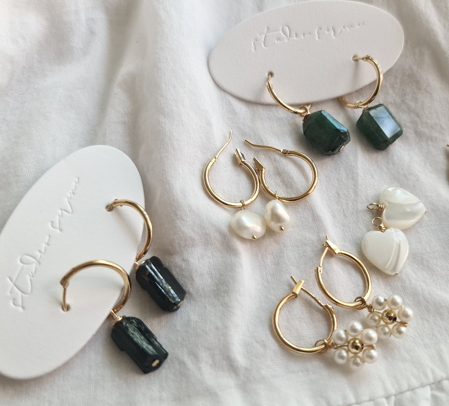 Interchangeable charms for hoops